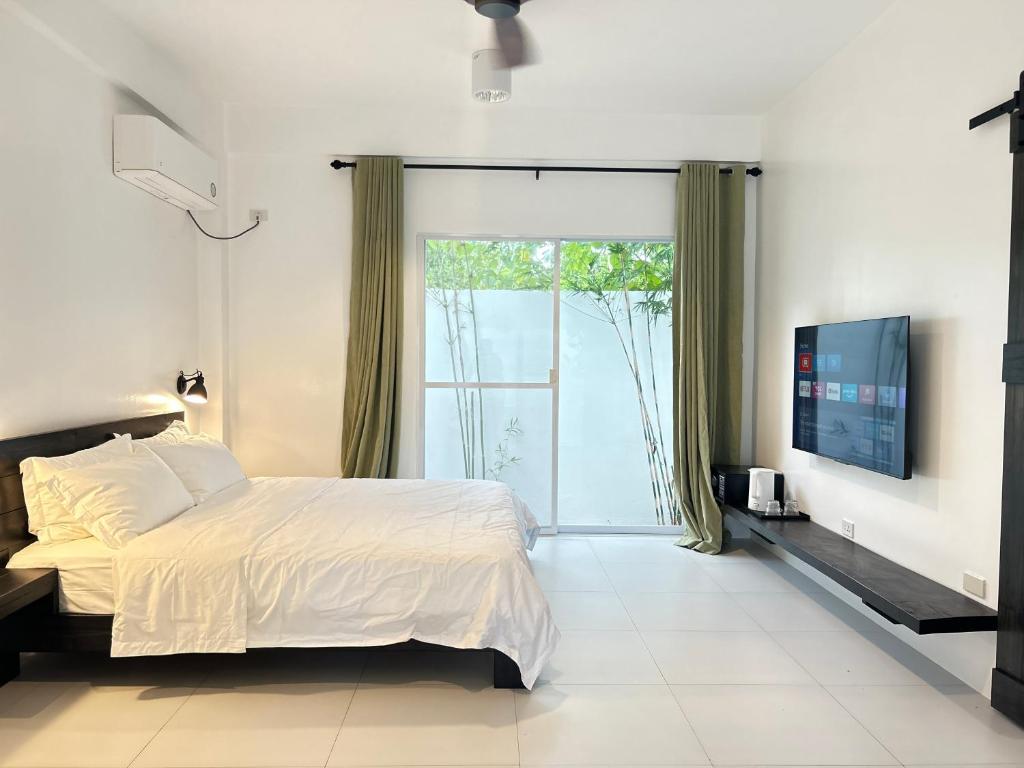 Bedroom with garden door and smart TV