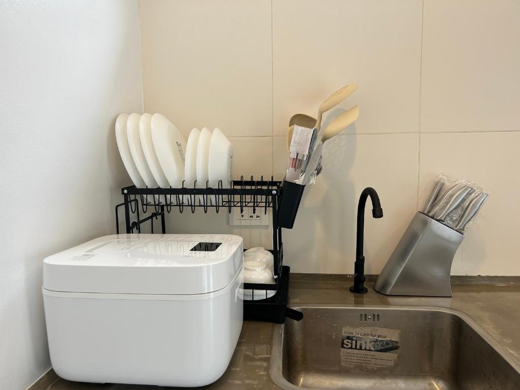 Kitchen sink and utensils