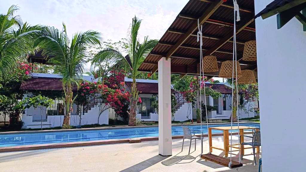 A swing by the poolside gazebo